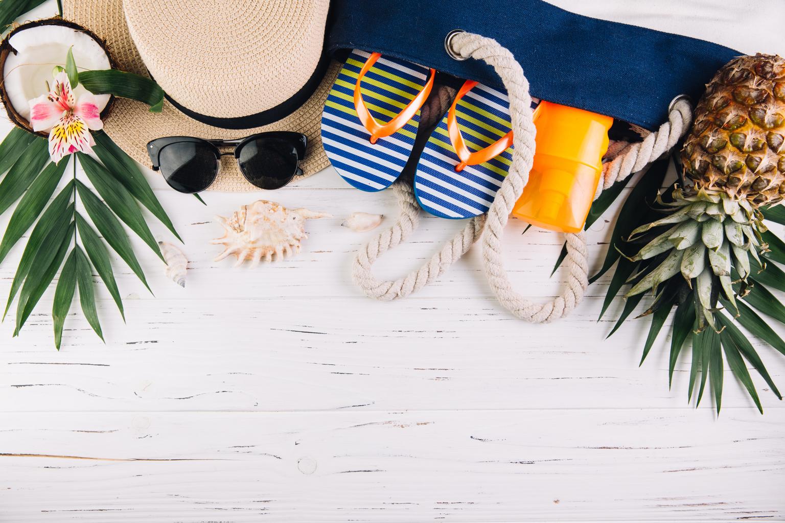 tropical travel packing beach items sunglasses hat